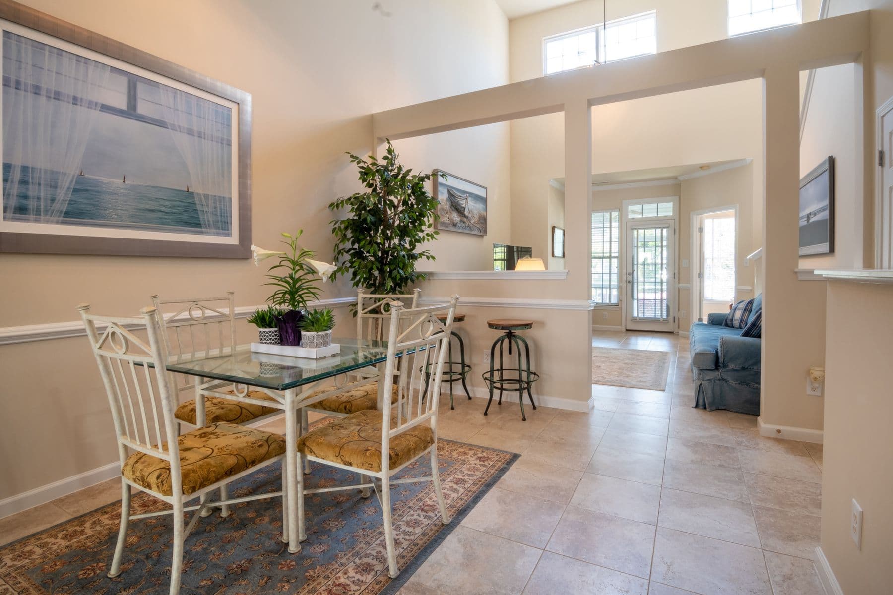 Dining area beside the kitchen with the terrace table for six visible through the glass