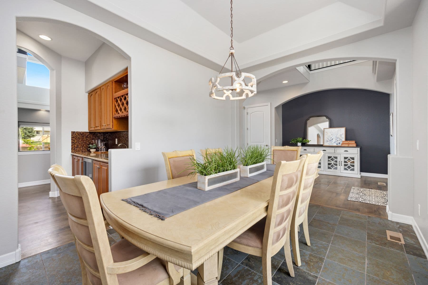 Dining room with table for ten beside the kitchen